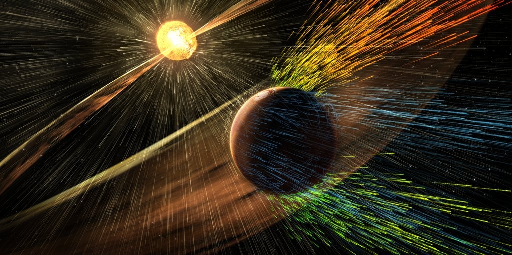 Artist's Concept of Solar Storm Hitting Mars.