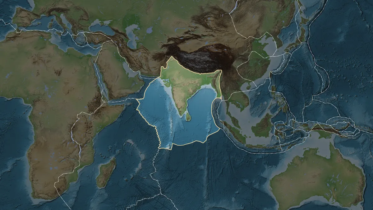 Scientists have grappled with two main hypotheses regarding the Indian Plate's behavior as it collides with Eurasia.