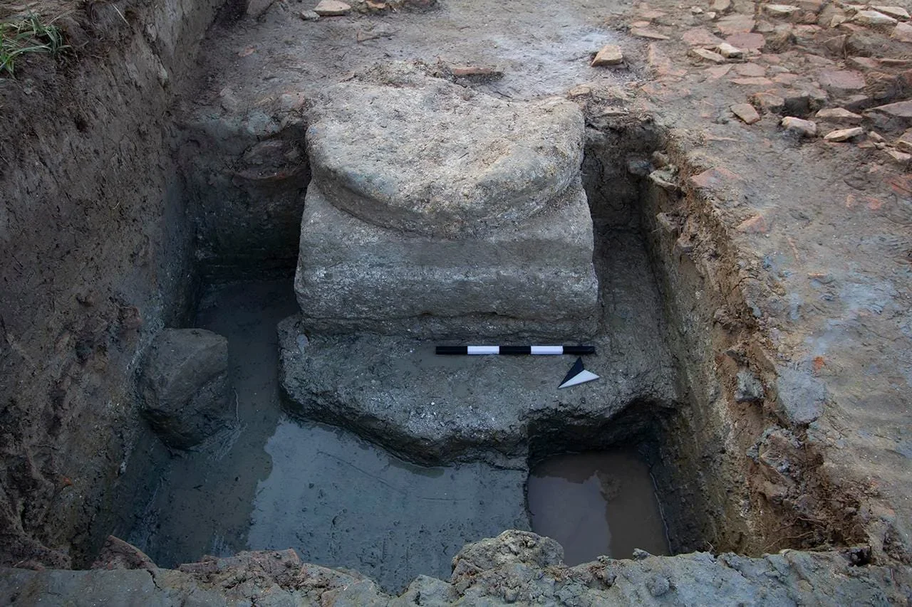 The column base has deep foundations and carried one of the inner central supports of a large roof that spanned the building.