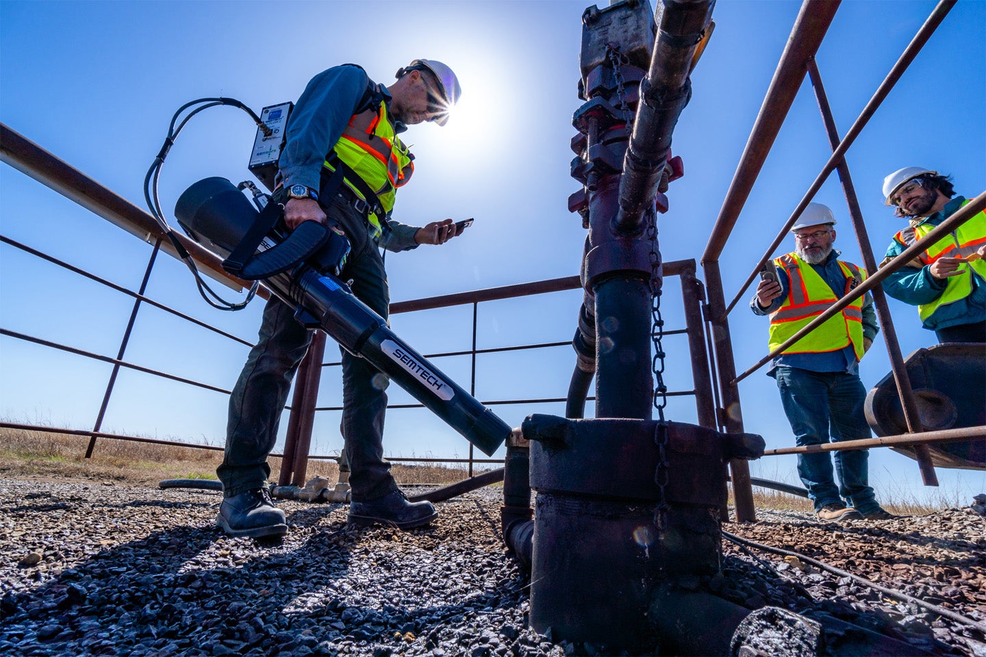 A state-of-the-art methane emission quantification tool works like a reverse leaf blower, sucking in air for rapid analysis in a backpack-carried system. This equipment, affectionately nicknamed “Gas Buster'' for its resemblance to the Ghostbusters’ proton packs, is used for more precise readings at wells for comparison with the lower-cost sensor methods that researchers are developing.